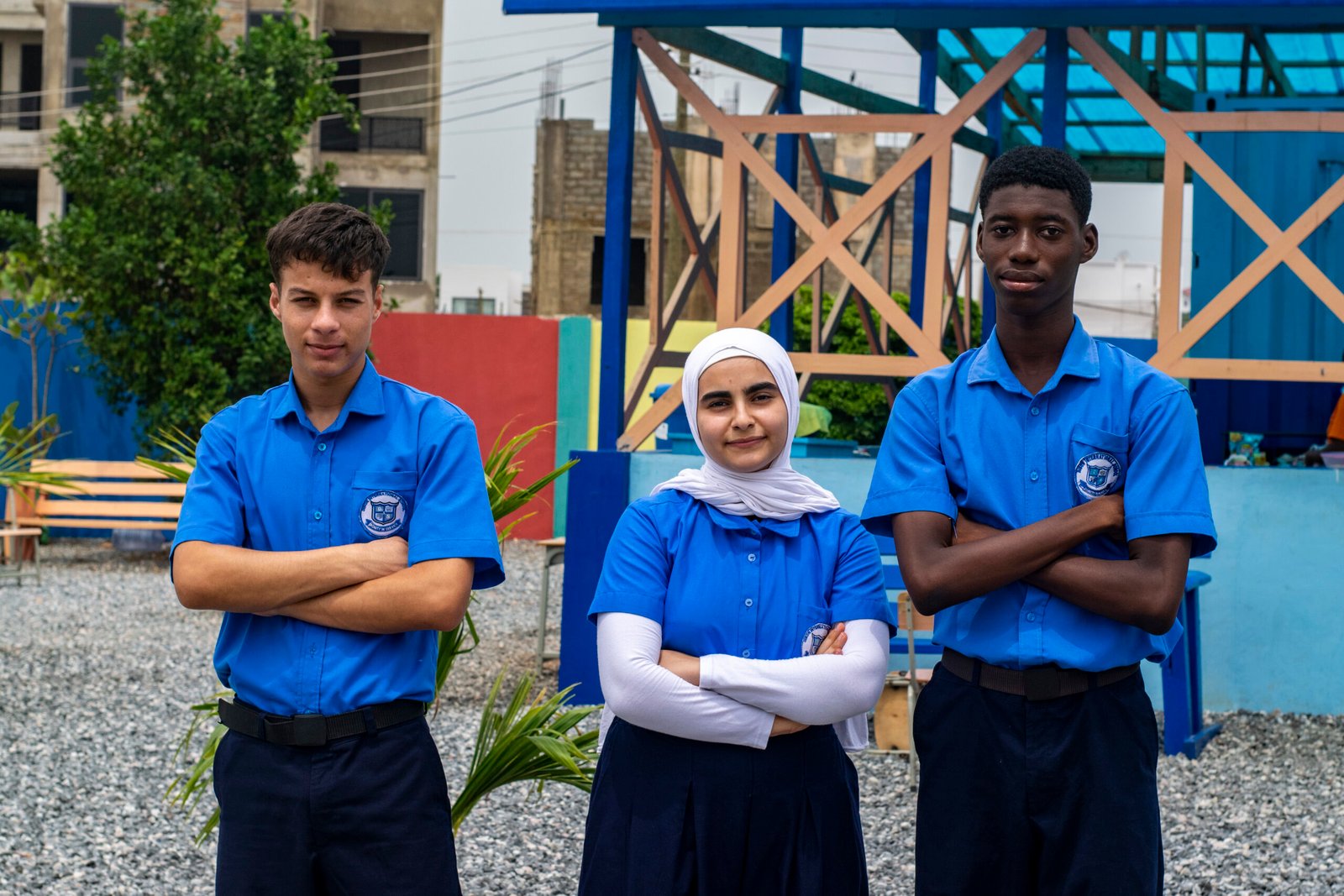 Three DIS secondary learners in school uniform on the Burma Hills campus
