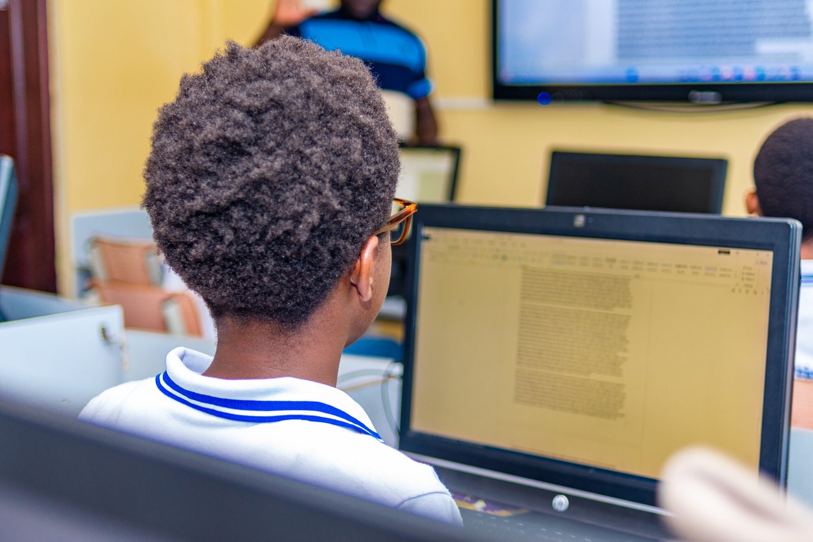 Learner working at a computer in the computer lab